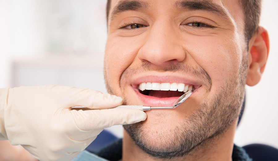 Dental Crown and Bridge man at dentist